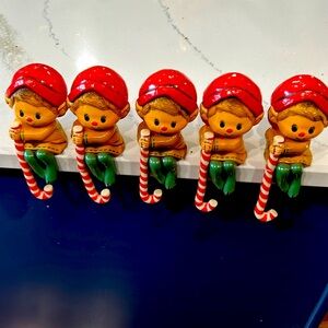 A collection of Vintage Hallmark Elf Stocking Hanger. A set of five. Repaired.